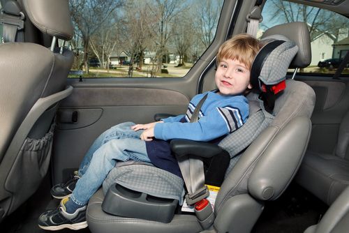 A child wearing safety seatbelt.